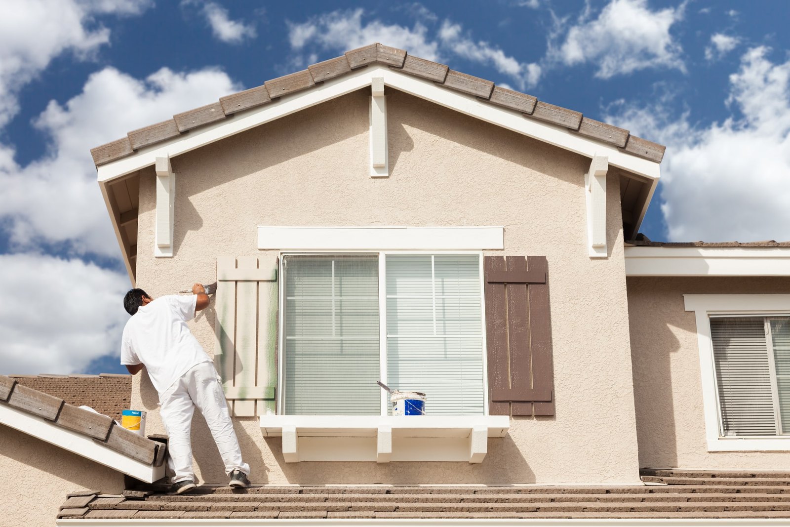 Painting a window shutter on a stucco gable in full sun