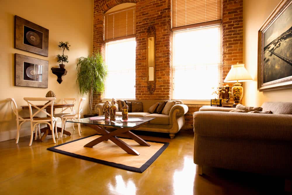 Living room with exposed brick and warm painted walls