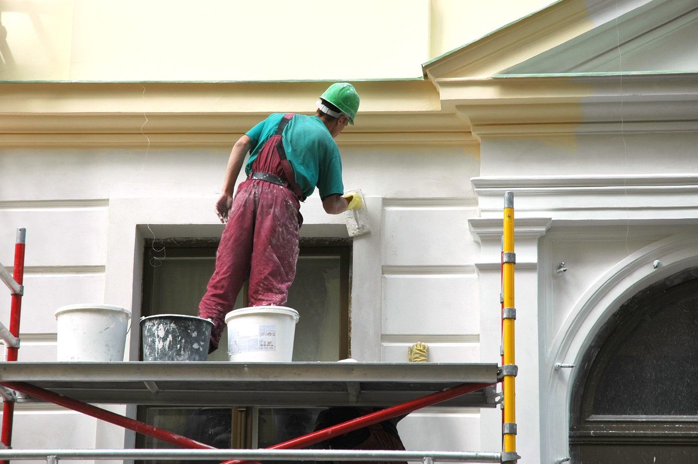Skimming and filling an ornate rendered facade from a scaffold
